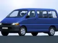 Niebieski van Toyota Hiace z lat 90. z widocznymi siedzeniami i oknami.
